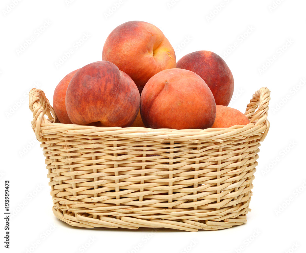 Ripe peach fruit isolated in basket on white background Ripe peach fruit isolated in basket on white background