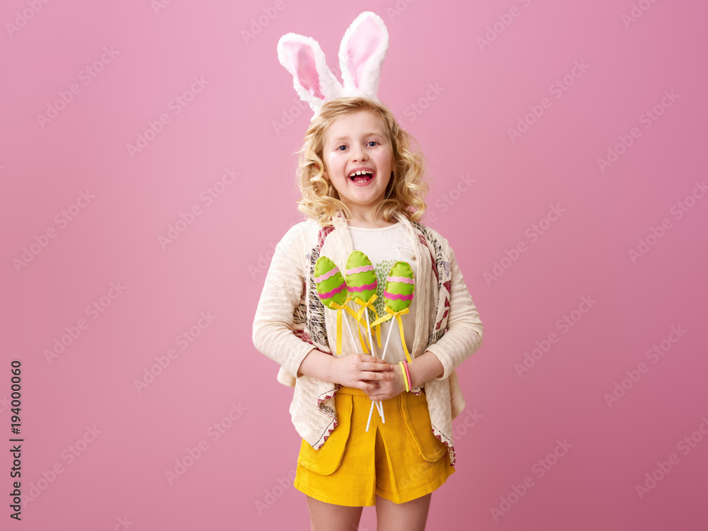 happy child on pink background with handmade Easter eggs happy child on pink background with handmade Easter eggs