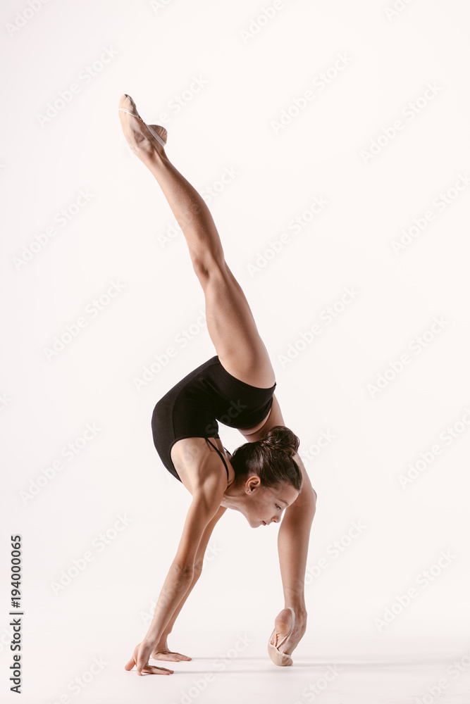 Young gymnast girl stretching and training Young gymnast girl stretching and training