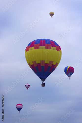 Colorful hot air balloons rising into air
