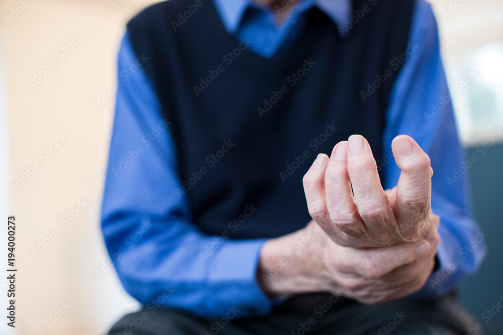 Fototapeta premium Close Up Of Senior Man At Home Suffering With Arthritis