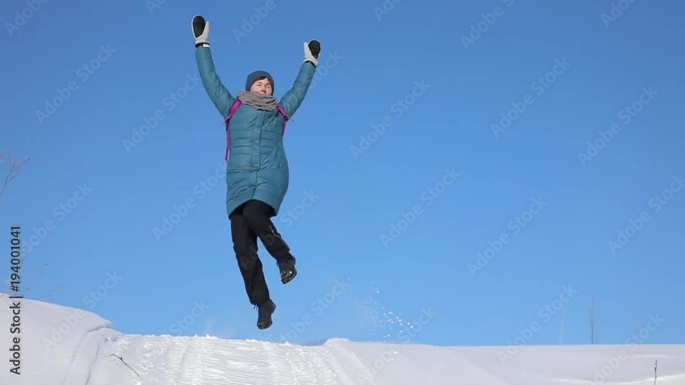 Beautiful woman dances on nature in the snow. She is happy in the winter. He smiles. Slow motion Beautiful woman dances on nature in the snow. She is happy in the winter. He smiles. Slow motion