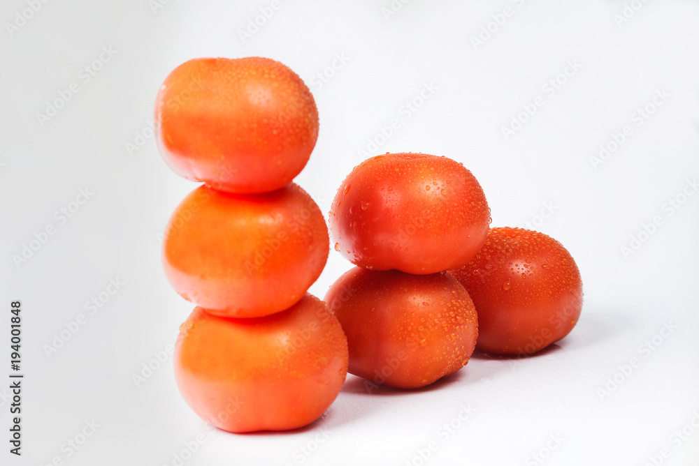 Tomatoes on a white background, different compositions. Tomatoes on a white background, different compositions.