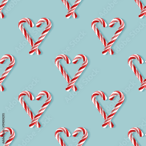 Seamless pattern with candy cane hearts