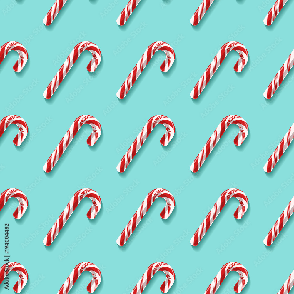 Seamless pattern with candy cane lollypops Seamless pattern with candy cane lollypops