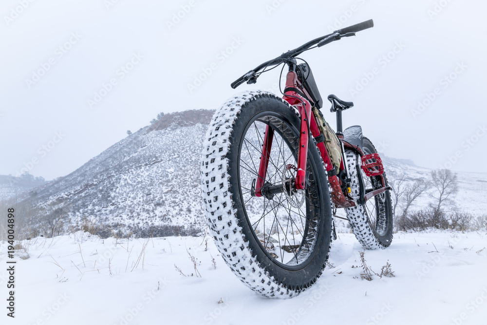 mountain fat bike in a snow blizzard mountain fat bike in a snow blizzard