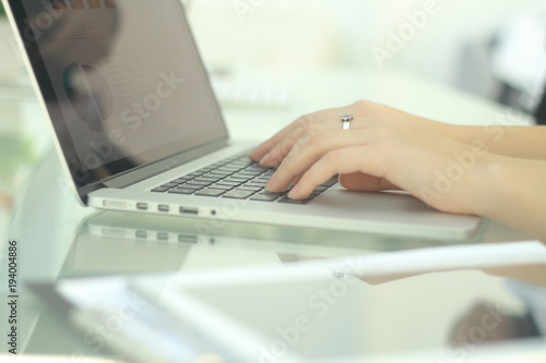 closeup.business woman typing on a laptop.