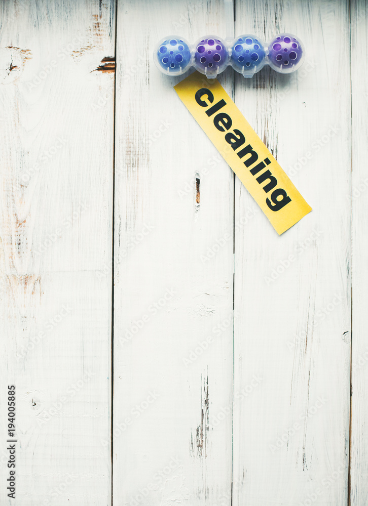 Cleaning house or office concept. Toilet refreshing block, Cleaning inscription on a white wooden background. Top view, closeup Cleaning house or office concept. Toilet refreshing block, Cleaning inscription on a white wooden background. Top view, closeup