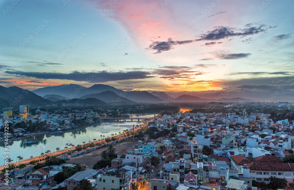 view of the city at sunset from a bird's eye view