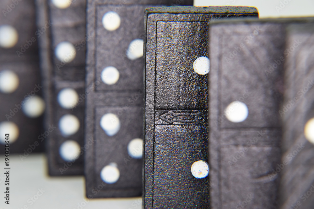 Dominoes Standing in a Row Focused on One Domino Piece Dominoes Standing in a Row Focused on One Domino Piece