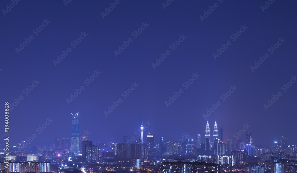 Kuala Lumpur city skyline during blue hour.Amazing view of urban city at night.