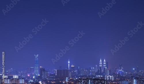 Kuala Lumpur city skyline during blue hour.Amazing view of urban city at night. © Apiq Sulaiman