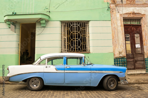 Photography Old American car parked on the cuban street