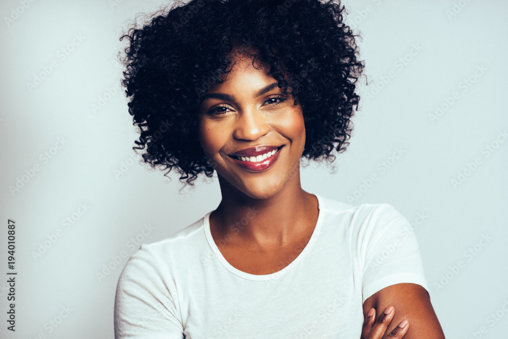 Profile of an attractive African woman against a gray background Profile of an attractive African woman against a gray background