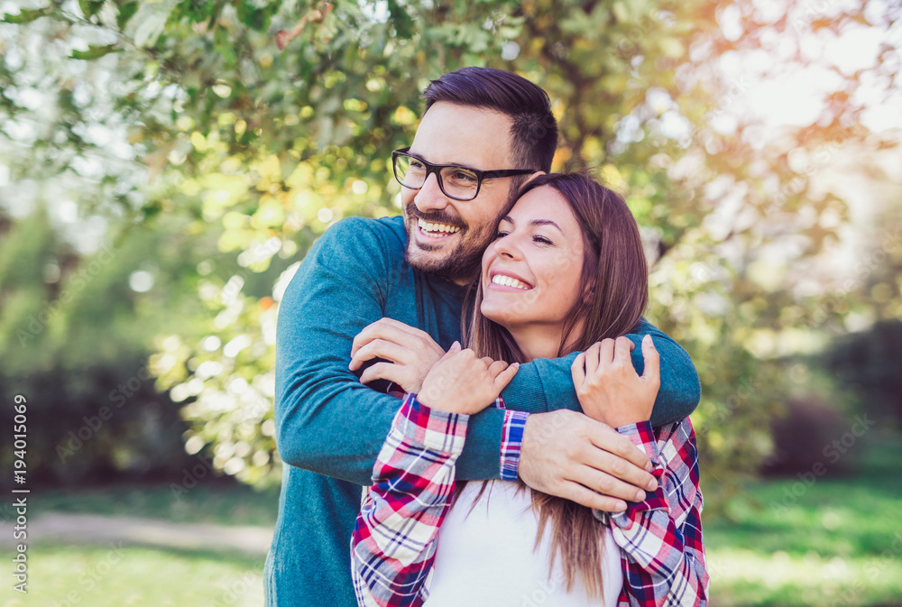Happy couple in love having fun outdoors and smiling. Happy couple in love having fun outdoors and smiling.