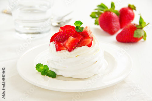 meringue nests with strawberry cream and fresh strawberries