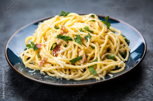 Fotografie Spaghetti carbonara with egg and pancetta