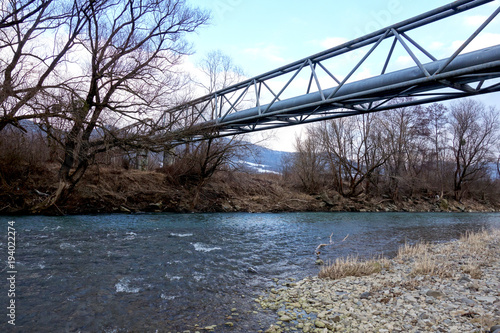 Heat pipe over the river photo