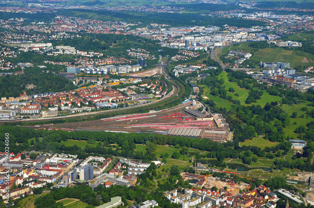 Closer Aerial view of Stuttgar - tBad Cannstatt area with Hauptpbahnhof (train station) and Rosensteinpark, south germany on a sunny summer day