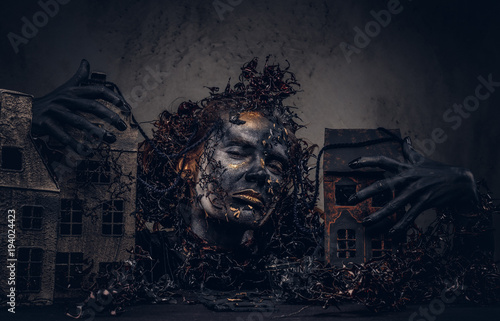 Make-up and horror concept. Abandoned city, absorbed by decompos photo