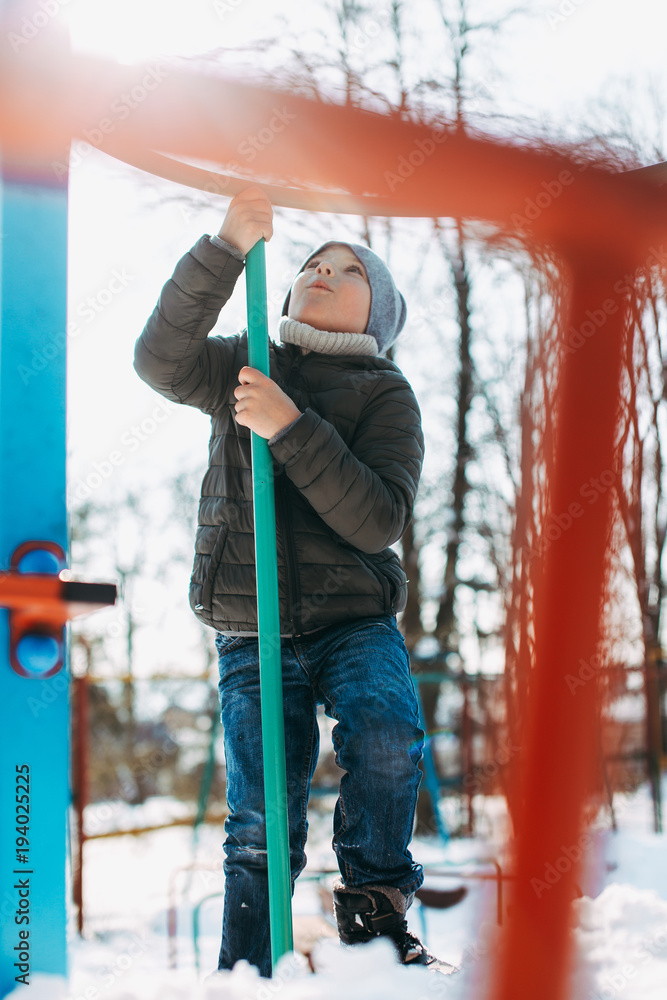 Fototapeta premium Boy have fun and smile to the camera. Smile and close eyes with snow