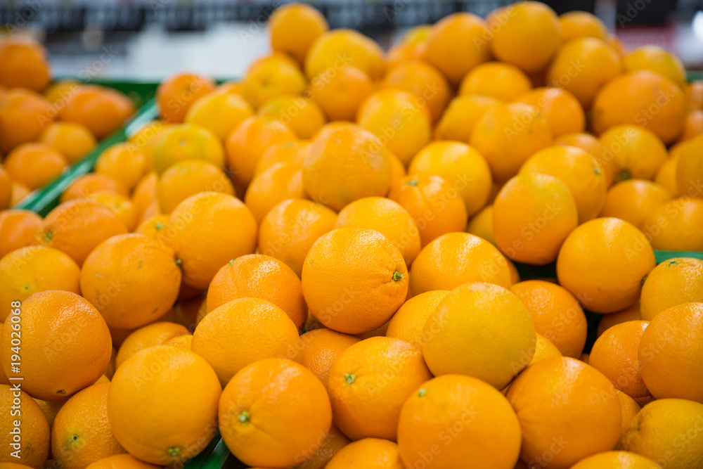 Oranges on the counter in the store. Close-up.