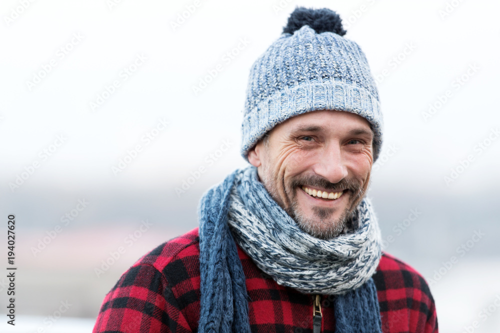 Portrait of urban smiling guy. Happy Men in hat and scarf. Funny men smiles to you. Closeup of smiling men face Portrait of urban smiling guy. Happy Men in hat and scarf. Funny men smiles to you. Closeup of smiling men face