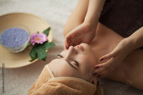 Face Massage. Close-up of a Young Woman Getting Spa Treatment