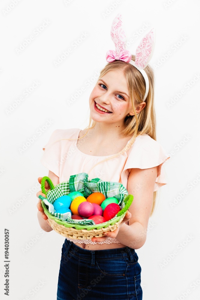 Teenage girl holding Easter eggs Teenage girl holding Easter eggs