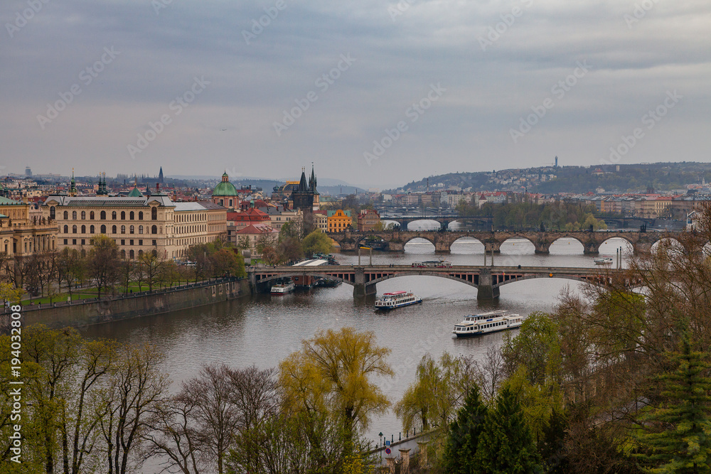 Prague wide panoramic view with old town and river from hill with park Letensky garden. Gloomy weather.