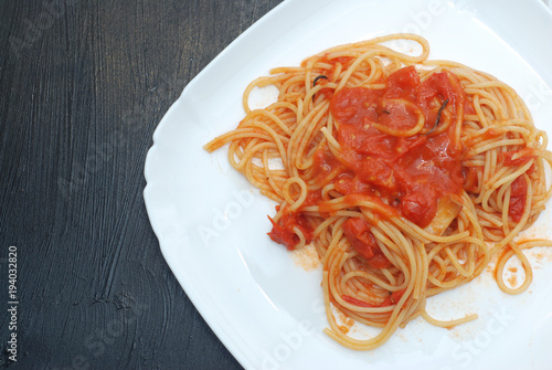 Italian Spagetthi Bolognese with Tomatoes Spiced Sauce in White Plate Isolated.