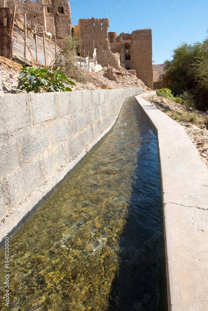 Naklejka premium Falaj watering system in Birkat Al-Mawz. The town is a village in the Ad Dakhiliyah Region of Oman. It is located at the entrance of Wadi al-Muaydin on the southern rim of Jebel Akhdar.