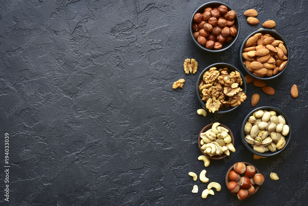 Assortment of nuts - healthy snack.Top view with copy space.