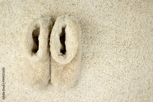 Slippers on carpet. Comfort. Home photo