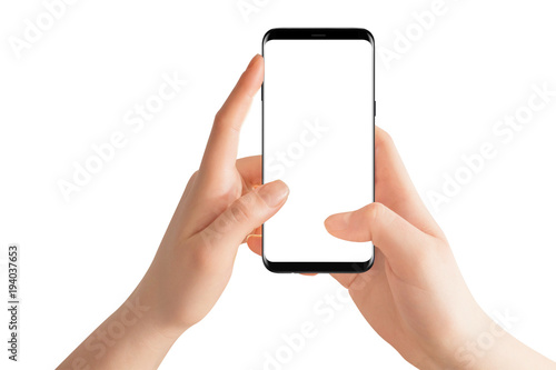 Female hands holding modern black phone in vertical position. Isolated hands and smartphone on white background.