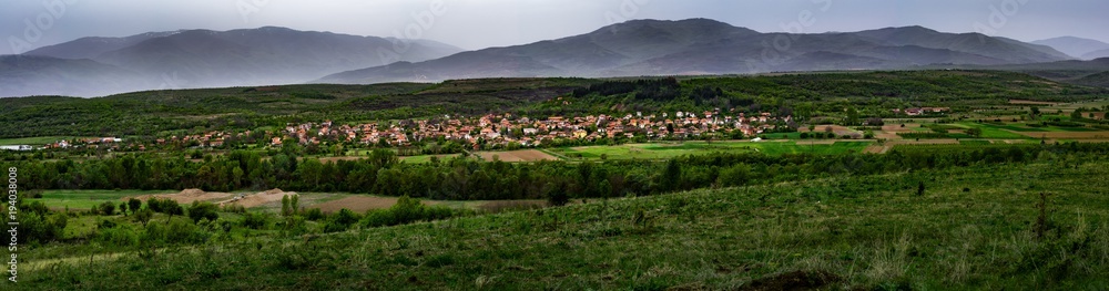 Village of Shishkovtsi, Bulgaria, During the Spring with Misty Mountains in the Back