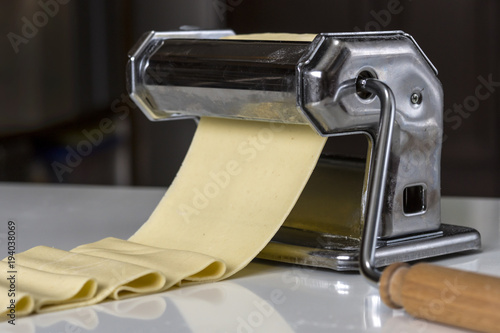 machine for rolling dough and cutting Italian pasta noodles