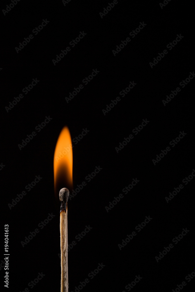 Wooden match on black background Wooden match on black background
