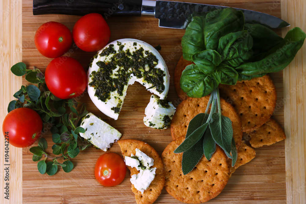 Cheese with fresh herbs and tomatos Cheese with fresh herbs and tomatos