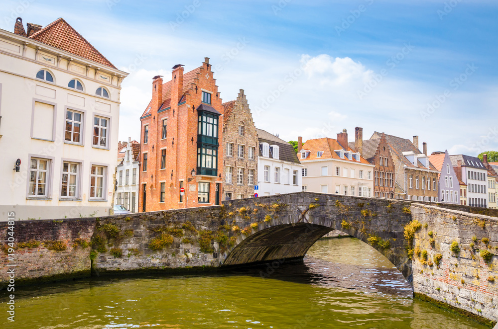 Beautiful canal and traditional houses in the old town of Bruges (Brugge), Belgium