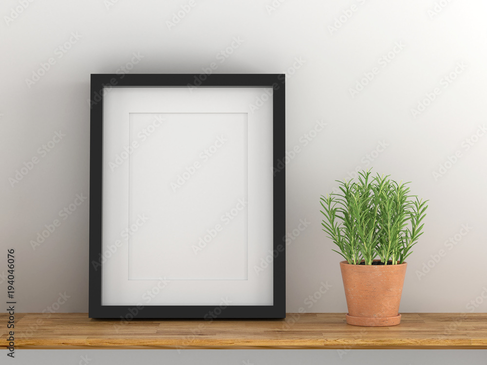 Blank black picture frame template for place image or text inside with a little tree on wood table. Blank black picture frame template for place image or text inside with a little tree on wood table.