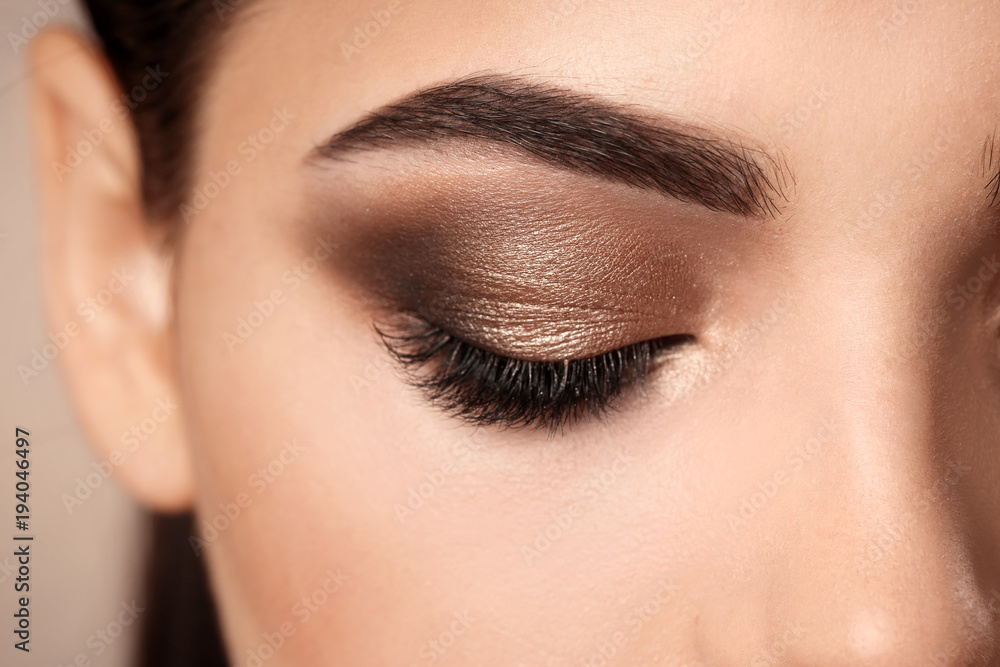 Fototapeta premium Woman with beautiful makeup, closeup. Professional visage artist work