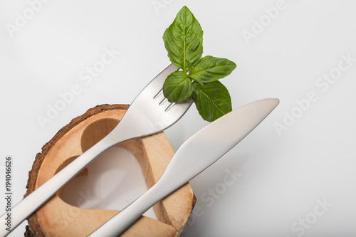 Metal inox cutlery on bright gray table