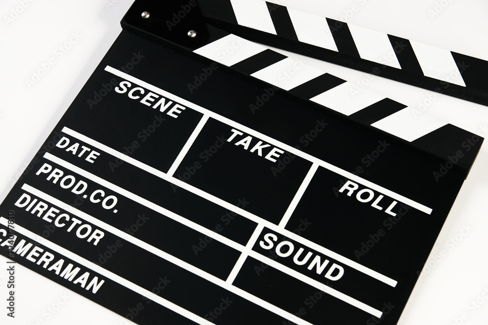 Obraz premium Movie production clapper board. Black clapperboard isolated on white background with copy space, close-up. 