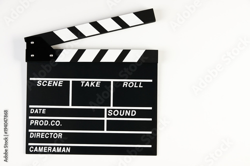 Movie production clapper board. Black clapperboard isolated on white background with copy space, close-up. 