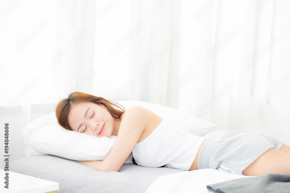 Beautiful asian young woman sleeping lying in bed with head on pillow comfortable and happy. girl with relax for health concept. Beautiful asian young woman sleeping lying in bed with head on pillow comfortable and happy. girl with relax for health concept.