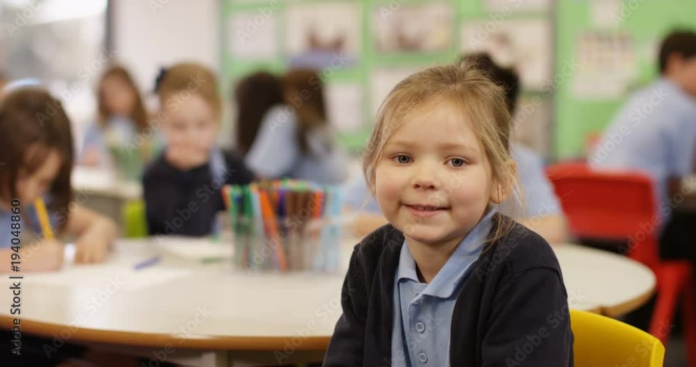 4K Portrait cute smiling little girl in primary school classroom. Slow motion 4K Portrait cute smiling little girl in primary school classroom. Slow motion