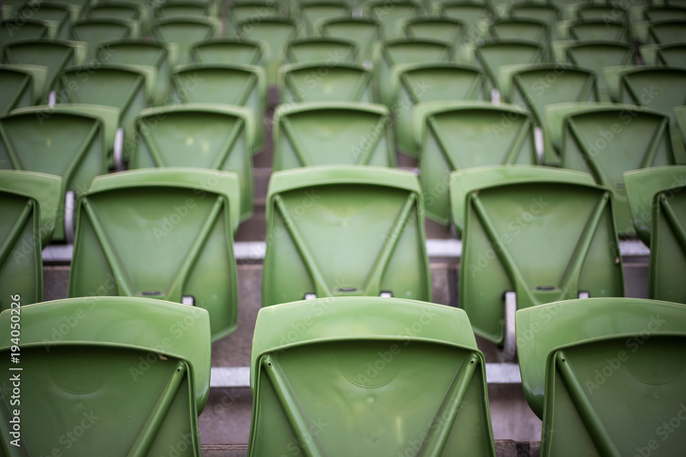 Fototapeta premium many rows of empty green stadium seats