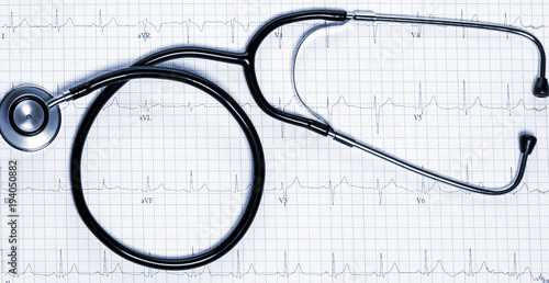 Stethoscope in shape of heart beat on electrocardiogram.