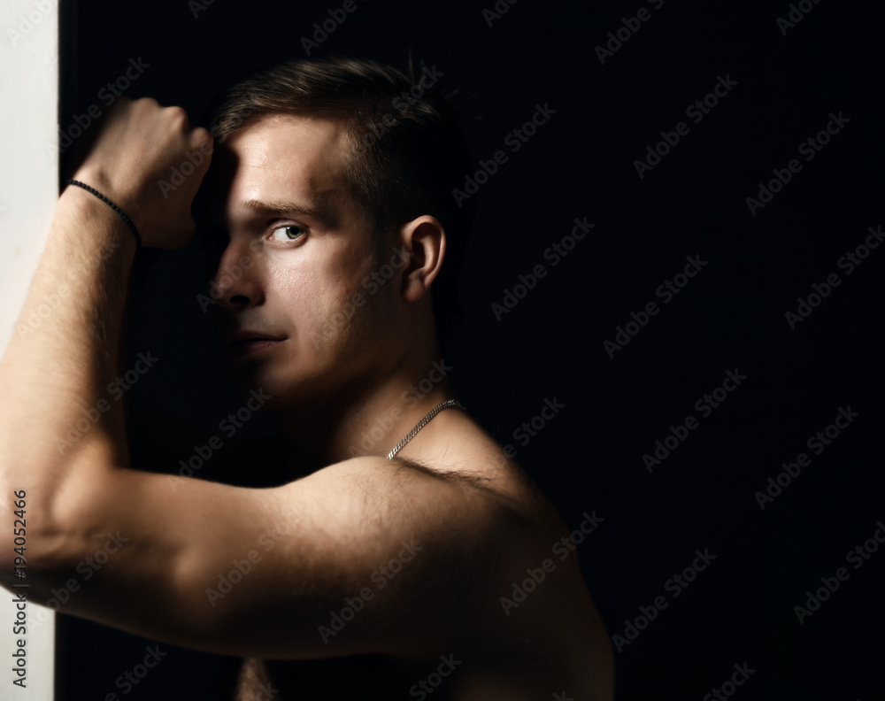 Fototapeta premium Closeup portrait of sexy handsome topless male model 